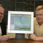 URI OCEAN ENGINEERING Prof. Malcolm L. Spaulding, left, the new president of the Northeast Regional Association for Coastal Ocean Observing Systems, is shown last summer, explaining his CoastMap software. Joining him is colleague Eoin Howlett, the CEO of Applied Science Associates. / 