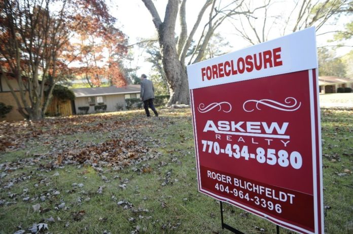 FORECLOSURE FILINGS last year affected about 1.84% of homes nationwide and 1.46% in Rhode Island. Above, a house in Sandy Springs, Ga. / FORECLOSURE FILINGS last year affected about 1.84% of homes nationwide and 1.46% in Rhode Island. Above, a house in Sandy Springs, Ga. /
