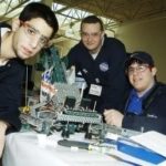 BURRILLVILLE HIGH team members show off the robot they created last winter for the 2008 FIRST Tech Challenge. / 