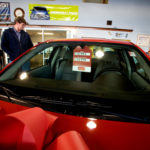 ON THE ROAD AGAIN: Jim Jager checks out cars at the Hurd Auto Mall in Johnston. Since Genral Motors’ financing affiliate, GMAC, accepted federal money last month, Hurd’s owner said he has witnessed a spike in sales. / PBN PHOTO/STEPHANIE EWENS