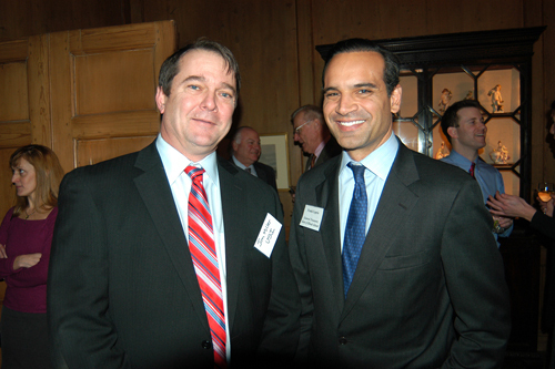RI General Treasurer Frank Caprio, Jr. (r) and USI of New England's Jim Miller. / PBN Photo/Frank Mullin