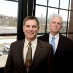 ATTORNEY GARY R. PANNONE, of the firm Pannone Lopes & Devereaux, left, and John J. Padien III, CEO of the Arc of Blackstone Valley, in Pannone’s Providence office. The law firm will present quarterly seminars to the leaders of nonprofit organizations. / 