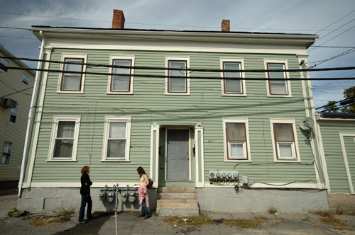 GASSED UP: West End residents Jessica Jennings, left, and Kari Lang stand in front of a Carpenter Street home where meters have been installed. / GASSED UP: West End residents Jessica Jennings, left, and Kari Lang stand in front of a Carpenter Street home where meters have been installed. /