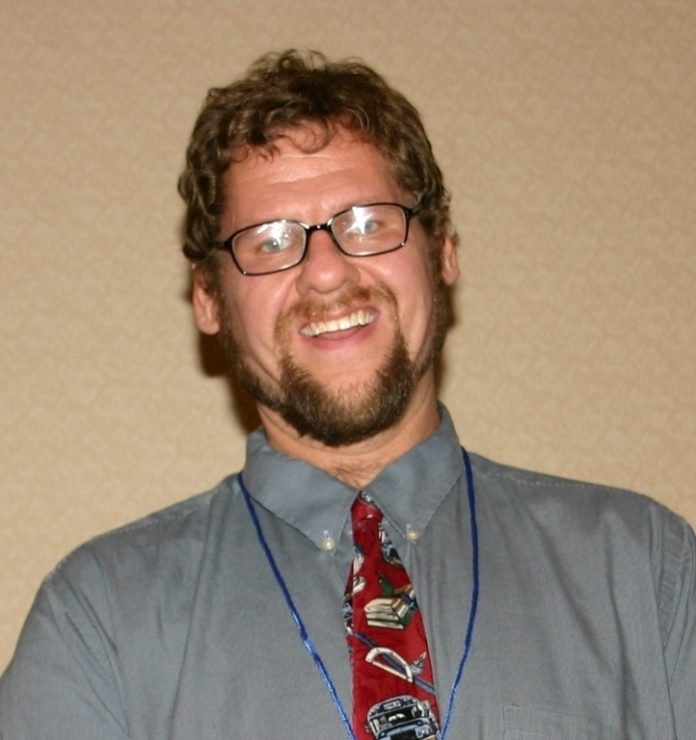 Greg Greco, a teacher at The Met School in Providence, has won a Math Hero Award. Above, he is shown last year after accepting another award, this one from the Asperger's Association of New England. / Greg Greco, a teacher at The Met School in Providence, has won a Math Hero Award. Above, he is shown last year after accepting another award, this one from the Asperger's Association of New England. /