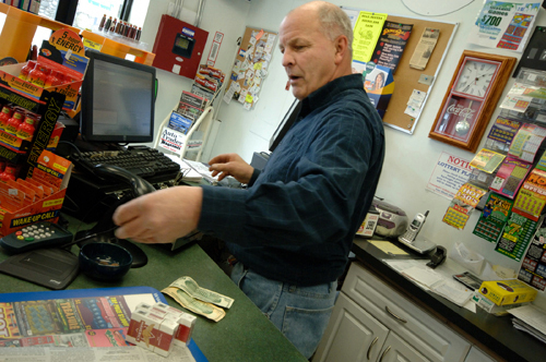 SMOKED OUT: Steven Biron’s business boomed after Massachusetts raised its cigarette tax, but could be hurt by similar plans in Rhode Island. / SMOKED OUT: Steven Biron’s business boomed after Massachusetts raised its cigarette tax, but could be hurt by similar plans in Rhode Island. /