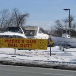 PLEADING FOR HELP: Boat World in Warwick, which is currently in receivership, has posted two yellow banners making its plight public. Other boat retailers in the state are in a similar situation. / 