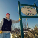 KEEPING FRESH: Tyler Young, above, and his wife, Karla Young, own Young Family Farm in Little Compton. They sell approximately one-fifth of their products directly to consumers. / 