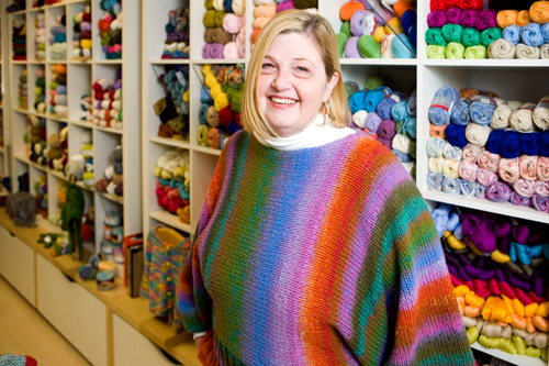KEEPING IT FRESH: Karen Holmes, owner of knitting store Fresh Purls on Hope Street in Providence, managed to turn her hobby into a business, serving customers aged 8 to 93. / KEEPING IT FRESH: Karen Holmes, owner of knitting store Fresh Purls on Hope Street in Providence, managed to turn her hobby into a business, serving customers aged 8 to 93. /