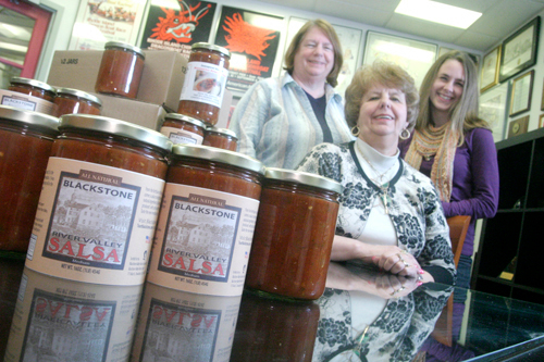 POWERFUL IMPACT: Blackstone Valley Tourism Council project coordinators Donna Houle, left, and Lorraine Provencher, center, and Emily Soergel, “Keep Blackstone Valley Beautiful” coordinator, are spearheading the marketing of salsa and dynamite sauce. / POWERFUL IMPACT: Blackstone Valley Tourism Council project coordinators Donna Houle, left, and Lorraine Provencher, center, and Emily Soergel, “Keep Blackstone Valley Beautiful” coordinator, are spearheading the marketing of salsa and dynamite sauce. /