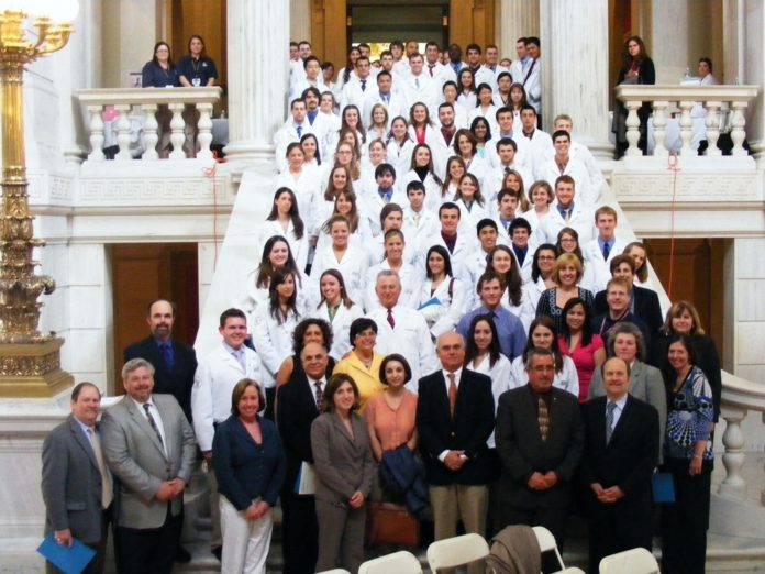 URI PHARMACY students were among those who attended last week's Statehouse rally. / URI PHARMACY students were among those who attended last week's Statehouse rally. /