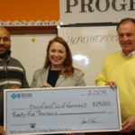 Carolyn Belisle (middle), director of community relations at BCBSRI, presents the BlueAngel Community Health Grant to Boys & Girls Club of Woonsocket Program Director Dennis Harmon (left) and Executive Director Dan Grabowski (right)