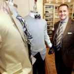 FITTING IN: Marc A. Streisand, president and owner of Marc Allen Fine Clothiers, says that people are dressing up to gain an employment edge in a rough economy. / 