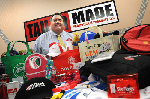 INCOMING CARGO: Vincent Lamoriello, president of Tailor Made Promotional Products Inc., shows off products his company imports from places that include Hong Kong and China. / INCOMING CARGO: Vincent Lamoriello, president of Tailor Made Promotional Products Inc., shows off products his company imports from places that include Hong Kong and China. /