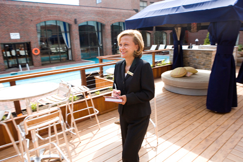 DONNA DiORIO, catering director at The Marriot Downtown Providence, checks the seating at Aqua, the new restaurant and lounge at the hotel. / DONNA DiORIO, catering director at The Marriot Downtown Providence, checks the seating at Aqua, the new restaurant and lounge at the hotel. /