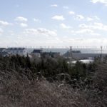 DOZENS OF WIND TURBINES are shown as they will look roughly 6.5 miles out from the shore in Barnstable, Mass., in a rendering of the proposed Cape Wind project provided by the developer. / 