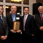 FROM LEFT: Roy Nascimento, president and CEO of New Bedford Area Chamber of Commerce; Nelson Hockert-Lotz, owner of Perfect Pizza Inc.; James R. Pratt, managing partner at Hodgson Pratt & Associates; and Thomas F. Lyons, president and CEO of BankFive. / 