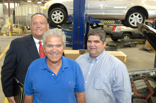 COLLISION INSURANCE: Attorney and estate-planning specialist David J. Correira, left, helped map out the ownership transition between Carl Garcia Sr., center, and Carl Garcia Jr. / COLLISION INSURANCE: Attorney and estate-planning specialist David J. Correira, left, helped map out the ownership transition between Carl Garcia Sr., center, and Carl Garcia Jr. /