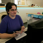 ENSURING SAFE TRIP: InsureMyTrip.com representative Jill Blanchard speaks with a customer at the company’s Warwick call center. / 