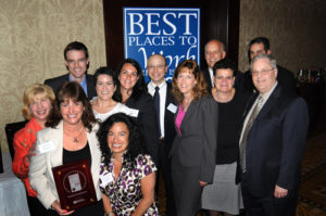 Oceanstate Financial Services accepts their award / PBN PHOTO/FRANK MULLIN