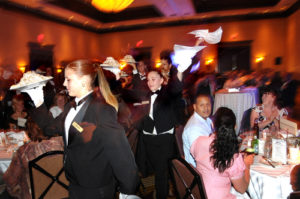 Crowne Plaza staff present Baked Alaska desert / PBN PHOTO/FRANK MULLIN