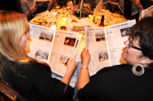 Providence Mutual Fire Insurance Company employees read Best Places Supplement / PBN PHOTO/FRANK MULLIN