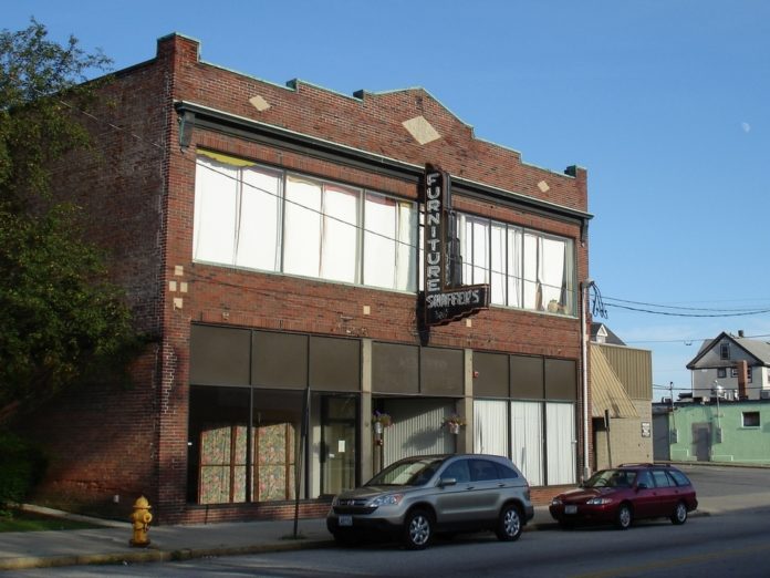 THE SCHAEFFER FURNITURE building's two first-floor storefronts will be combined to make one 2,500-square-foot space, for which XPO has signed a five-year lease. / 