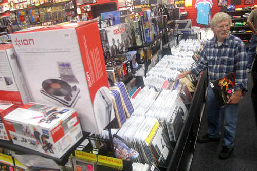 FOR THE RECORD: Bob Edwards of Foster peruses the vinyl section at Newbury Comics in Providence Place, eventually settling on a Jimi Hendrix LP. / FOR THE RECORD: Bob Edwards of Foster peruses the vinyl section at Newbury Comics in Providence Place, eventually settling on a Jimi Hendrix LP. /
