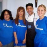 BCBSRI BLUEANGEL volunteers Elena Morel, Sandy Solitro and Shannon Broadbent  with McCauley House Chef Stanley Moss. / 