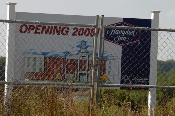 DESPITE AN AGREEMENT that dates back two years, there has been little work done at the site for a Hampton Inn along the Blackstone River in Pawtucket. / DESPITE AN AGREEMENT that dates back two years, there has been little work done at the site for a Hampton Inn along the Blackstone River in Pawtucket. /