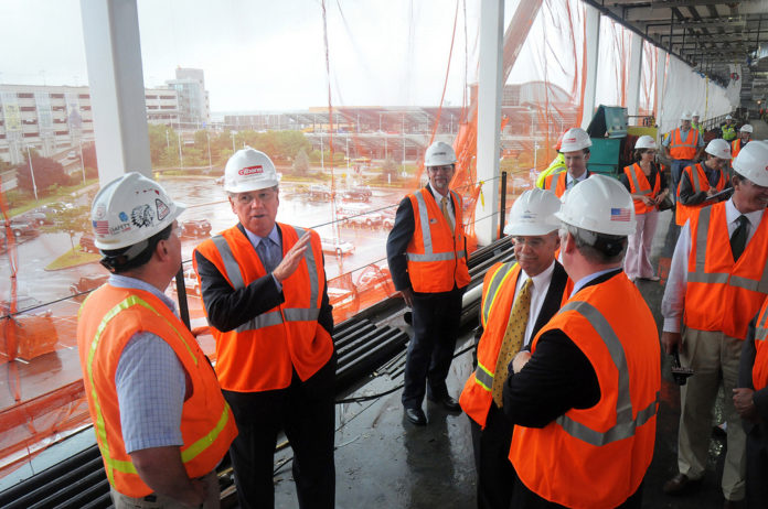 GOV. DONALD L. CARCIERI, center left, led a tour of the T.F. Green Airport intermodal station project, which is 40% complete, according to RIAC President Kevin Dillon. / 