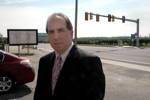 TALL TASK: Joseph Scianna, owner of Joseph Big and Tall, could be displaced if the preferred airport expansion plan moves forward. / TALL TASK: Joseph Scianna, owner of Joseph Big and Tall, could be displaced if the preferred airport expansion plan moves forward. /