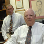 TRICKS OF THE TRADE: Howard Zwick, foreground, and his son, Timothy Zwick, of World Trade Exchange in North Kingstown. / 