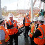 Warwick airport project nearing halfway point FROM A TO B: Gov. Donald L. Carcieri, second from left, and other state and local officials tour the intermodal transportation facility being built near T.F. Green Airport. /