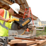 Building firms fight to survive recession DIMEO CONSTRUCTION’S employee Brian Johnson cuts molding for a pavilion at the Ocean House in Westerly. /