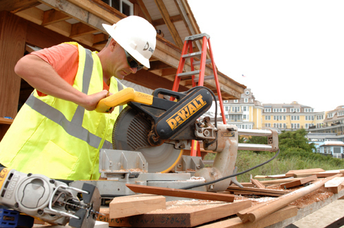 DIMEO CONSTRUCTION’S employee Brian Johnson cuts molding for a pavilion at the Ocean House in Westerly. / DIMEO CONSTRUCTION’S employee Brian Johnson cuts molding for a pavilion at the Ocean House in Westerly. /