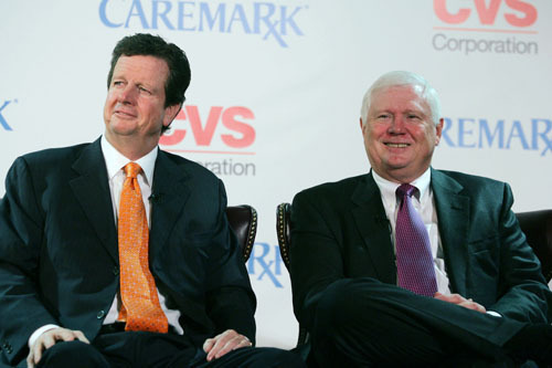 CVS CEO THOMAS RYAN, left, and Caremark Rx CEO Mac Crawford announced that they would become a single company in 2006, above. The merger has come under growing criticism in recent months. / CVS CEO THOMAS RYAN, left, and Caremark Rx CEO Mac Crawford announced that they would become a single company in 2006, above. The merger has come under growing criticism in recent months. /