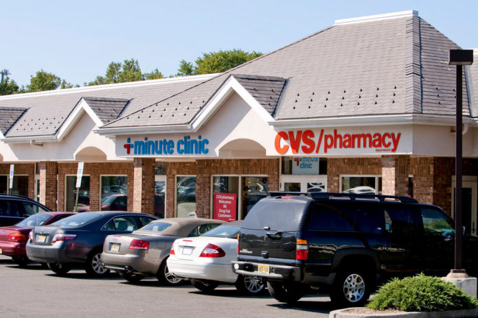 CVS CAREMARK will offer free seasonal flu shots at its MinuteClinic retail health centers to unemployed and uninsured people this fall. / CVS CAREMARK will offer free seasonal flu shots at its MinuteClinic retail health centers to unemployed and uninsured people this fall. /