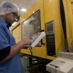 ENERGY CONCERNS: Polytop Corp. processor Ricky Ogunwomoju operates a machine that uses a significant amount of electricity. The company fears a proposed change in energy rate setting will hurt its bottom line. / 