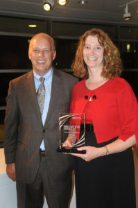 PBN Publisher Roger Bergenheim with honoree Kimball Hall, VP of AMGEN / PBN PHOTO/FRANK MULLIN