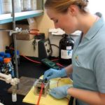 WASTE NOT: URI engineering student Sarah Hanselman works to turn biodiesel waste into something useful. / 