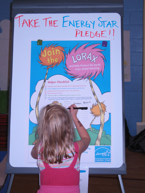 STARRING ROLE: A student from Harvard Elementary School in Massachusetts signs the Lorax Energy Star Pledge at a recent event hosted by National Grid. / STARRING ROLE: A student from Harvard Elementary School in Massachusetts signs the Lorax Energy Star Pledge at a recent event hosted by National Grid. /