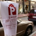 SPECIAL COVERINGS, shown above, have been placed on parking meters in parts of the city to designate where drivers can park for free during the holidays. / 
