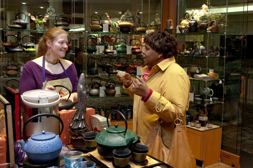 TEA TIME: Erin Mayer, left, manager of Teavana in Providence Place mall,
speaks with customer Florence Pierre. / TEA TIME: Erin Mayer, left, manager of Teavana in Providence Place mall,
speaks with customer Florence Pierre. /