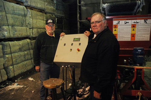 WASTE NOT: Ron Kollross, left, and David R. Sherman co-own KWD Inc./ReFoamIt. The North Smithfield company recycles about 40,000 pounds of Styrofoam a month, with a capacity for much more. / WASTE NOT: Ron Kollross, left, and David R. Sherman co-own KWD Inc./ReFoamIt. The North Smithfield company recycles about 40,000 pounds of Styrofoam a month, with a capacity for much more. /