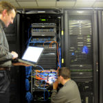 Atrion inspires loyalty in staff, clients alike APPLYING SOLUTIONS: Kevin Frost, left, an Atrion management-services specialist, and Lucien Menard, an Atrion IT systems specialist, examine network connections at the Warwick company. /