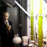 Iowa Gov. Chet Culver, left, listens as BioProcessAlgae CEO Tim Burns explains how a system at an ethanol plant captures CO2 emissions and uses it to grow algae. BioProcessAlgae, a spinoff of Portsmouth-based BioProcessH20, is running the Iowa demonstration project. The company hopes to launch additional demonstration projects at a coal-fired power plant and an industrial site next year. / 