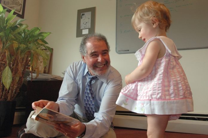 THE NEW TEST, developed by a team led by Barry Lester, director of the Brown Center for the Study of Children at Risk at Women & Infants Hospital and The Warren Alpert Medical School of Brown University, shown above with his granddaughter Isabel. / 