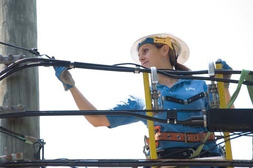 PLUGGED IN: Gina Barsanti, technician for Cox Communications Inc., works on a network. Cox is available to 98 percent of Rhode Island’s homes, according to a company spokeswoman. / PLUGGED IN: Gina Barsanti, technician for Cox Communications Inc., works on a network. Cox is available to 98 percent of Rhode Island’s homes, according to a company spokeswoman. /