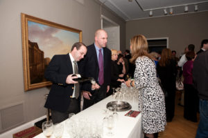 Sponsor Mark Gasbarro serves wine to guests / PBN Photo/ Stephanie Ewens