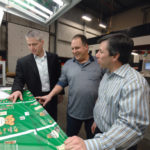 New tools, thinking propel Admiral Packaging ADMIRAL QUALITIES: Admiral Packaging Inc. press operator Walter Beauchamp, center, goes over product quality with company Vice President John Wilbur, left, and President Harley Frank. /
